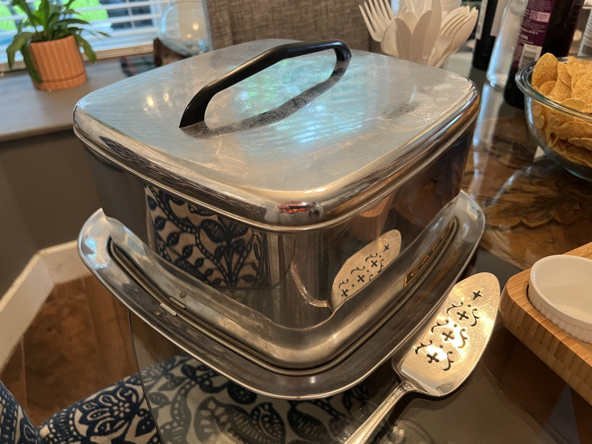 Traveling cake tin: A vintage traveling cake tin, perfect for pot-lucks and game nights.; cake; A Traveling Man’s Cookery Book