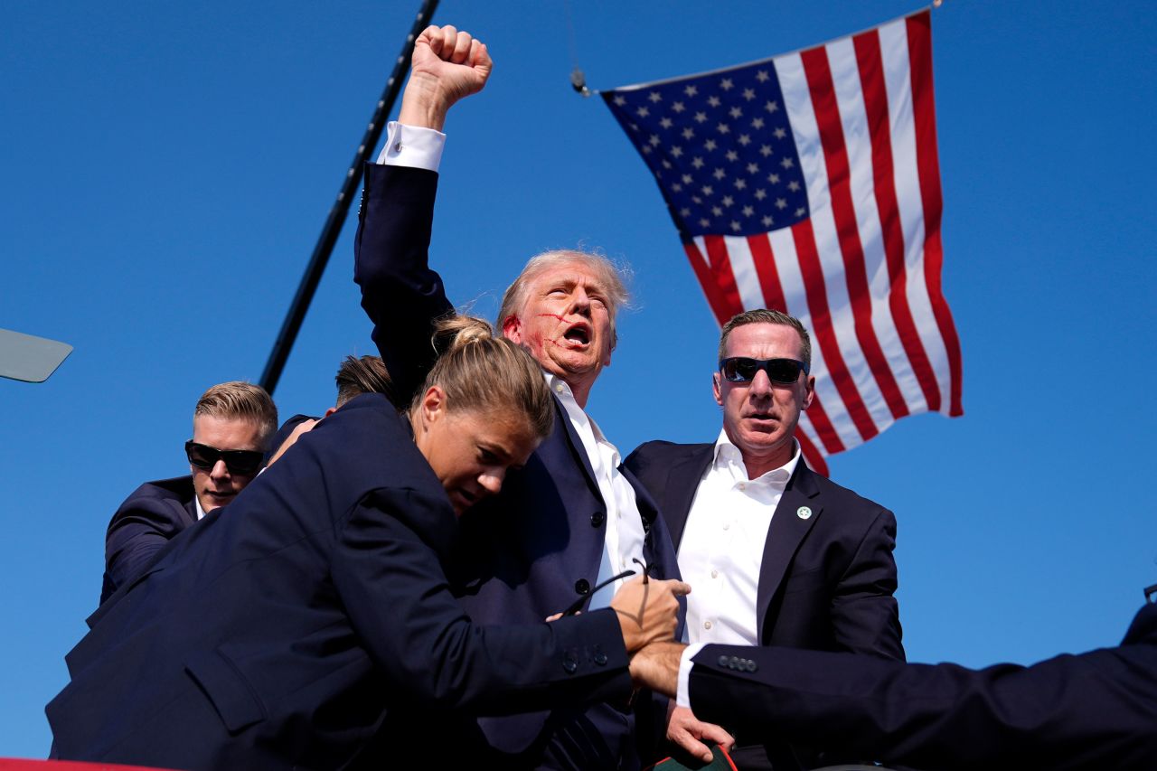Donald Trump: “Fight!”: Donald Trump gets back up after assassination attempt. Fist in the air, shouts “Fight!” Photograph by Evan Vucci.; assassination; President Donald Trump